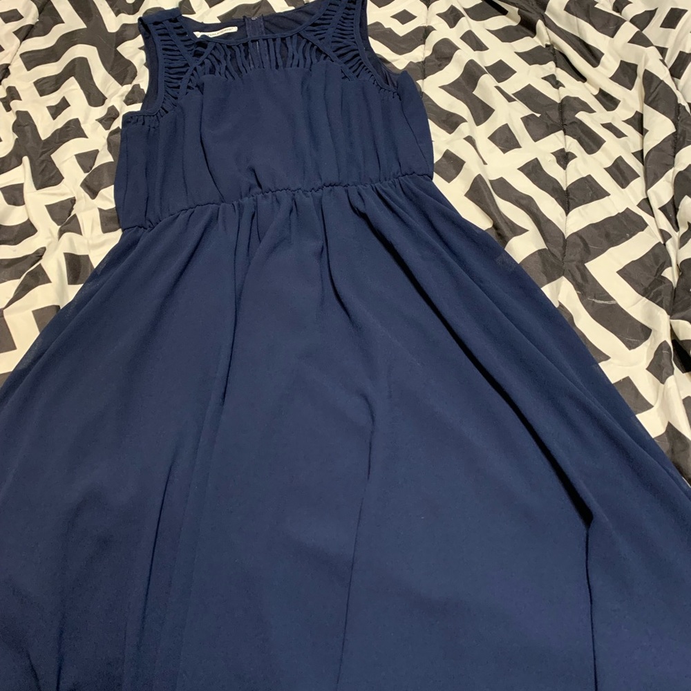 Beautiful navy blue sleeveless dress with cage detailing on chest.